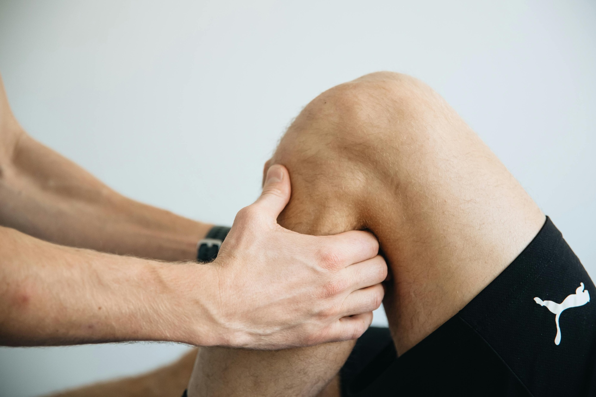 Patient performing a guided rehabilitation exercise in a bright clinic
